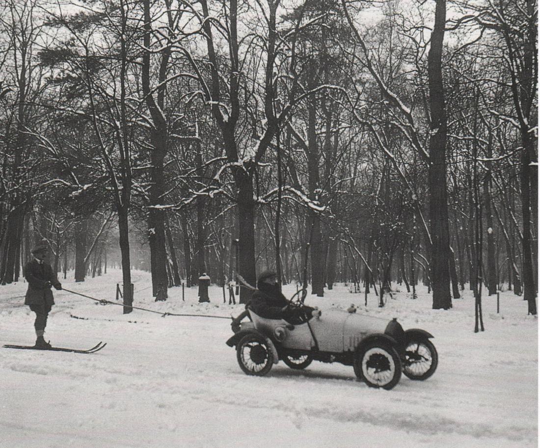 J. H. LARTIGUE - Bois de Boulogne, Francis Piqueton,: Artist: J. H. LARTIGUE Print Title: Bois de Boulogne, Francis Piqueton, champion de France, behind a BB Peugeot,1916 Medium: Photo-Lithograph Printed 1980’s in France Image size (inches) approx. 5 x