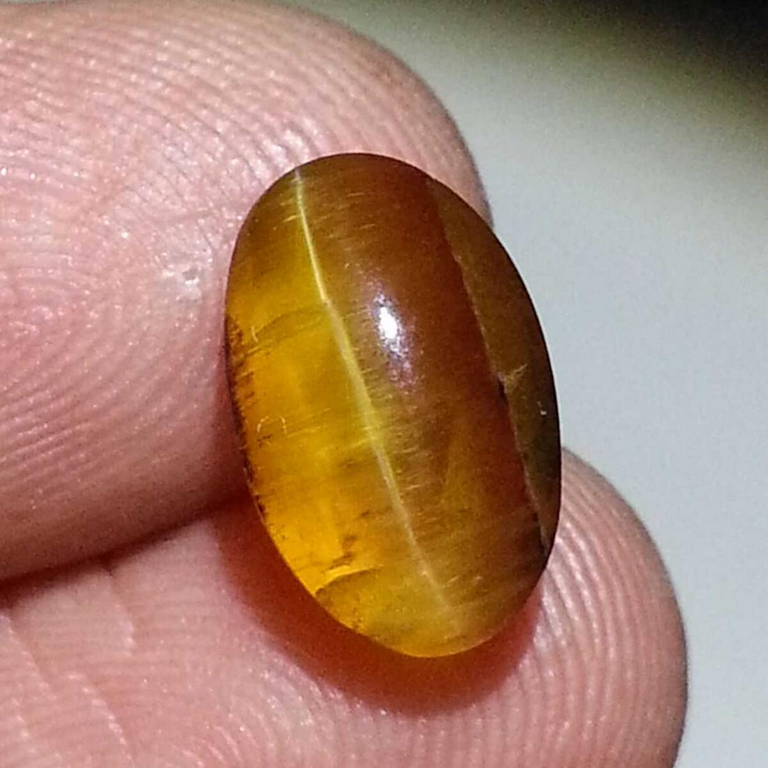 3.63 ct Natural Opal Cat's Eye: No Reserve! Title: 3.63 ct Natural Opal Cat's Eye Color/Clarity: Semi Transparent Gemstones: Loosegemstone Carat Weights: $4 Size/Dimensions: 12.00 x 7.50 x 6.60 Additional Information: Oval - Africa 