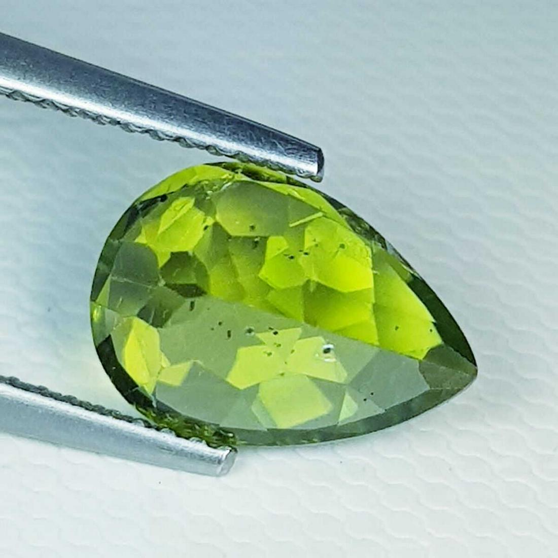 3.07 ct Natural Peridot Pear Cut: No Reserve! Title: 3.07 ct Natural Peridot Pear Cut Color/Clarity: VVS Gemstones: Loosegemstone Carat Weights: $3 Size/Dimensions: 11.00 x 7.80 x 5.50 Additional Information: Pear - Pakistan Shipping: