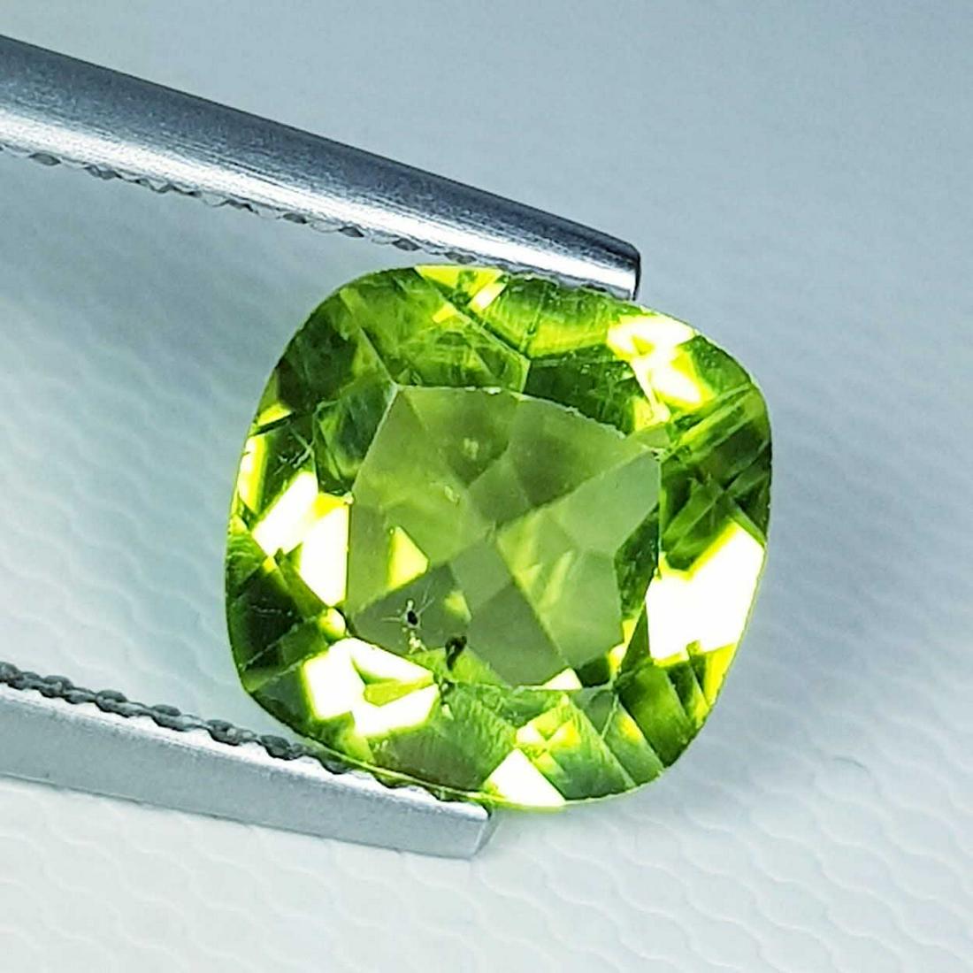 2.05 ct Natural Peridot Cushion Cut: No Reserve! Title: 2.05 ct Natural Peridot Cushion Cut Color/Clarity: VVS Gemstones: Loosegemstone Carat Weights: $2 Size/Dimensions: 8.00 x 8.00 x 4.30 Additional Information: Cushion - Pakistan Ship