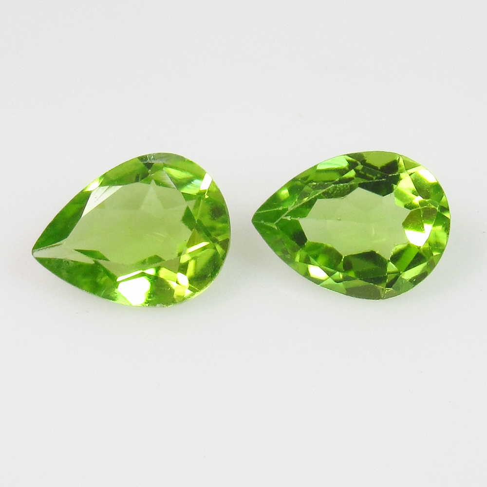 2.10 Ctw Natural Pakistan Peridot 8X6 mm Pear Pair: No Reserve! Title: 2.10 Ctw Natural Pakistan Peridot 8X6 mm Pear Pair Stone Clarity: VVS Loose Gemstone: Peridot Carat Weights: 2.10 Size/Dimensions: 8.00 x 6.00 x 3.30 mm Top Class Luster / Excellent
