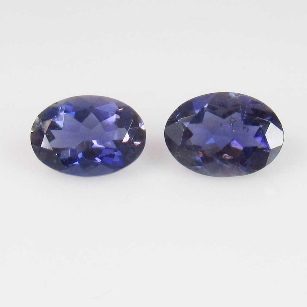 1.30 Ctw Natural Iolite 7X5 mm Oval Pair: No Reserve! Title: 1.30 Ctw Natural Iolite 7X5 mm Oval Pair Stone Clarity: VVS Loose Gemstone: Iolite Carat Weights: 1.30 Size/Dimensions: 7.20 x 5.10 x 3.50 mm / 2 PC's Very Good Luster / Excellent O