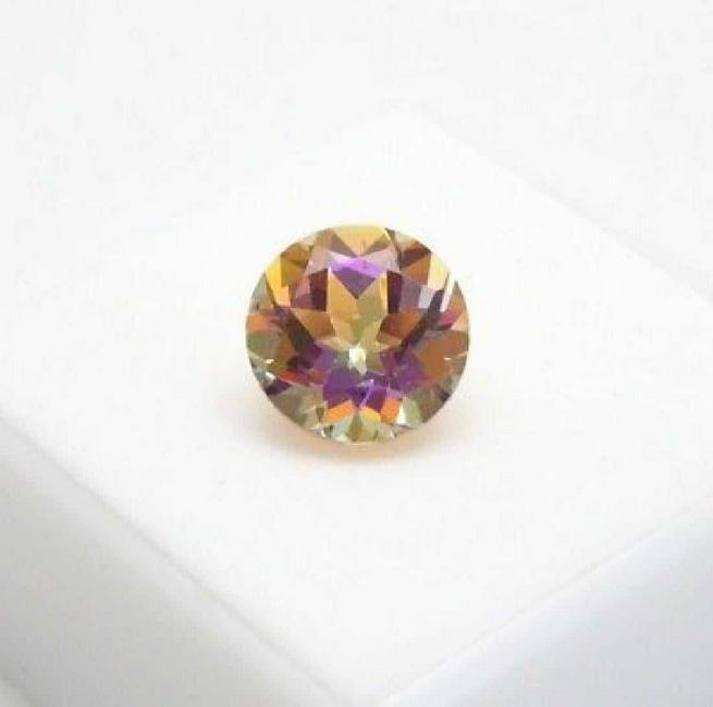 5,13 ct Mistic Topaz 5,13 ct: No Reserve! Title: 5,13 ct Mistic Topaz 5,13 ct Loose Gemstone: Mistic Topaz 5,13 ct Carat Weights: 5,13 ct Size/Dimensions: 11,11x11,06x6,99 Origin: brazil Shipping: Domestic: Flat-rate of $35.00 to 