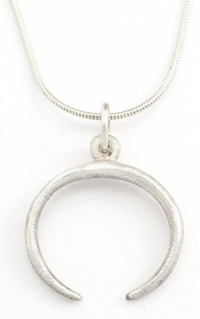 VIKING LUNAR PENDANT C.900-1000 AD: Just over 7/8Â” width. As expert navigators, the constellations signified mystery and power to Vikings. The Moon was personified as Mani, brother to Sol the Sun, and is abundantly represented in No