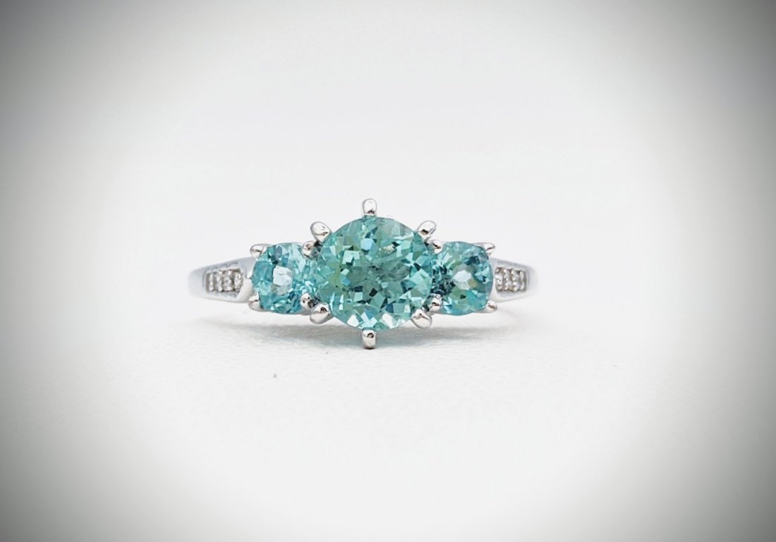 Sterling Silver Sz 7 Apatite & Diamond Ring: Title: Sterling Silver Sz 7 Apatite & Diamond Ring Brand: Jean Lin Collection Metal Purity: 925 Sterling SilverGemstones: Apatite & Diamond Carat Weights: 1 Round Apatite at 6mm (0.84ct), 1 Round Apat