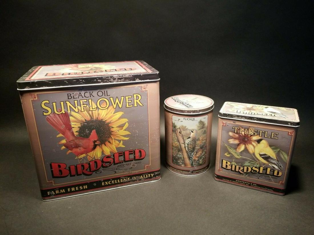 Set of 3 Advertising Tin Box Sunflower Bird Seed: The large tin is 11 3/4" tall x 12" long x 8" wide The round tin is 7 7/8" tall x 5 1/2" wide The small tin is 7" long x 3 3/4" wide x 7 7/8" tall Great set of reproduction food tins! These are labele