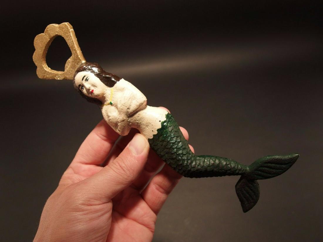 Cast Iron Mermaid Lady Soda Beer Bottle Cap Opener: 8 1/2" Long ..2 3/4" Wide Great reproduction heavy solid Iron bottle opener. This piece was made to look just like an antique, but is actually new. Nicely made all cast iron... Great for use or displa