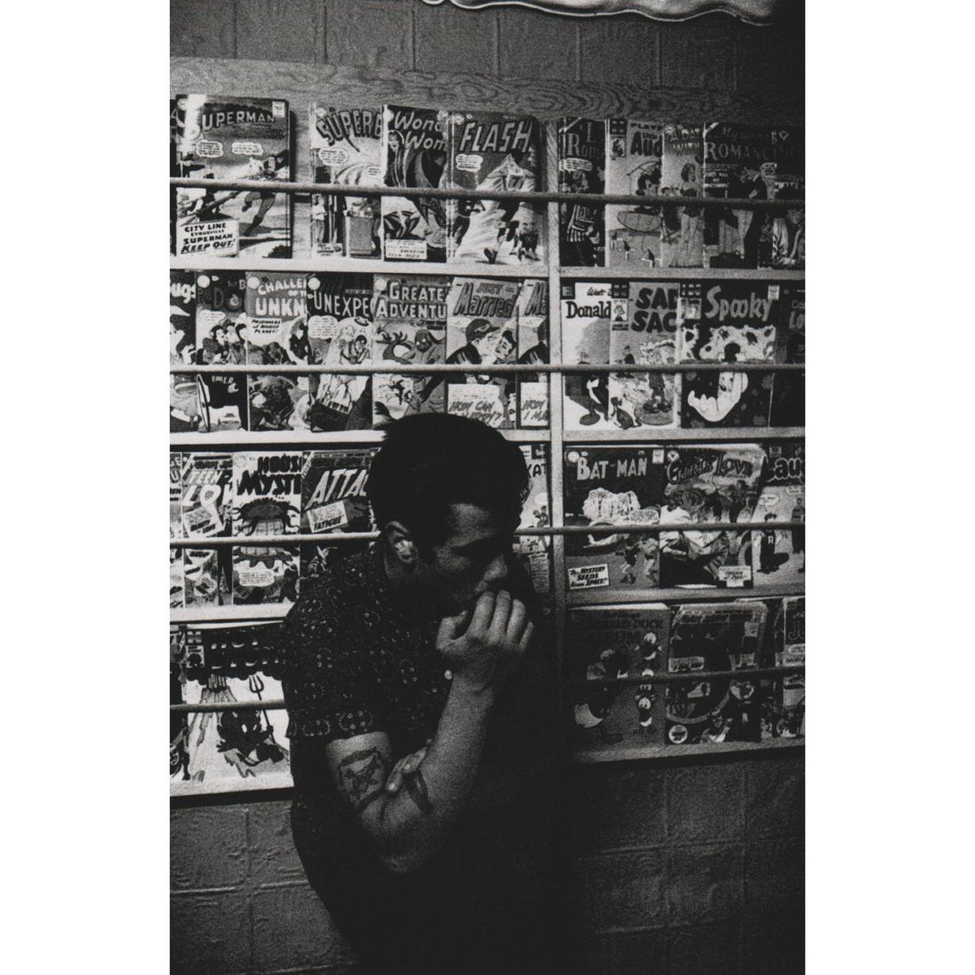 BRUCE DAVIDSON - Brooklyn Gang, Comic Book Store: Artist: BRUCE DAVIDSON Print Title: Brooklyn Gang, Comic Book Store Medium: Sheet-fed Gravure Printing Date: 1990's Printed in Japan Image Size: 8.25 x 5.5 inches Bruce Davidson (b. 1933) is an Americ