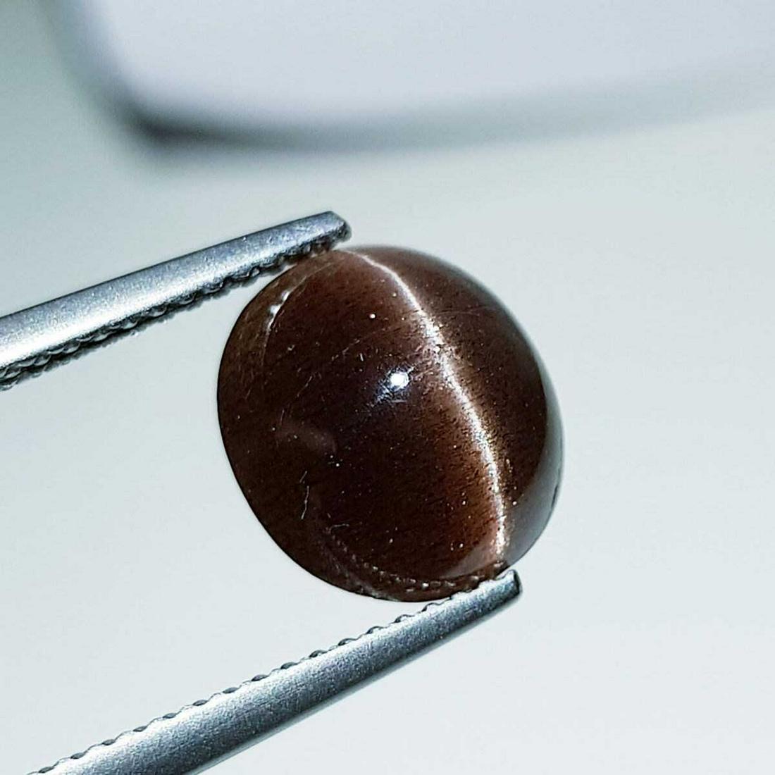 4.05 ct Natural Scapolite Cat's Eye: No Reserve! Title: 4.05 ct Natural Scapolite Cat's Eye Color/Clarity: Opaque Gemstones: Loosegemstone Carat Weights: 4.05 Size/Dimensions: 10.30 x 9.60 x 5.70 Additional Information: Oval - Africa Shi