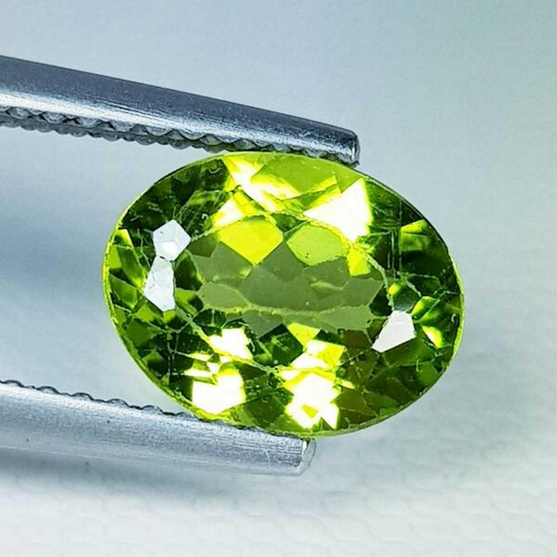 Natural Peridot Oval Cut 1.75 ct: No Reserve! Title: Natural Peridot Oval Cut 1.75 ct Color/Clarity: VVS Gemstones: Gemstones Carat Weights: 1.75 Size/Dimensions: 8.90 x 6.90 x 4.00 Additional Information: Oval - Pakistan Shipping: W