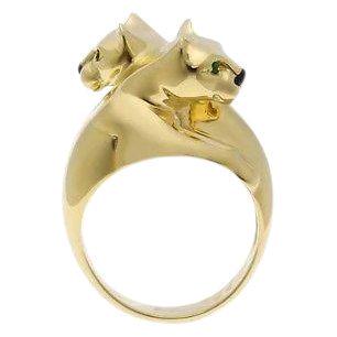 Cartier 18K Yellow Gold Double Panthere Ring Sz 51: This iconic Cartier Panthere ring is a very rare and highly collectible piece. It is done in 18k yellow gold with two pantheres facing each other featuring emerald eyes and onyx noses. The collection 