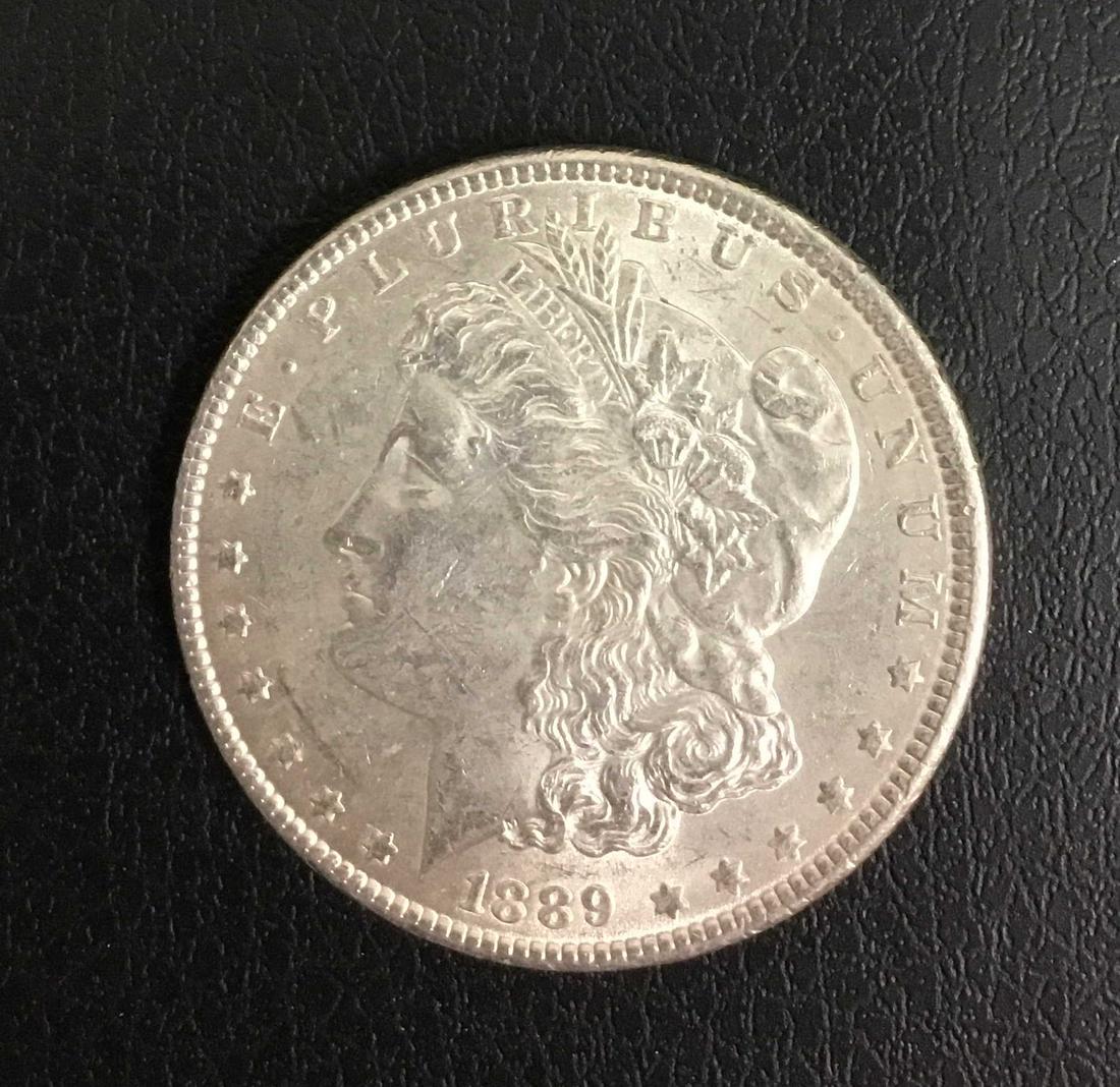 1889 Morgan Silver Dollar: Title: 1889 Morgan Silver Dollar Description: 1889 Morgan Silver Dollar Date/Period: 1889 Materials: 90% Silver Dimensions: 38.1mm Additional Info:EF40RAW Reserve: $23.00 Shipping: Domestic: Flat-rate