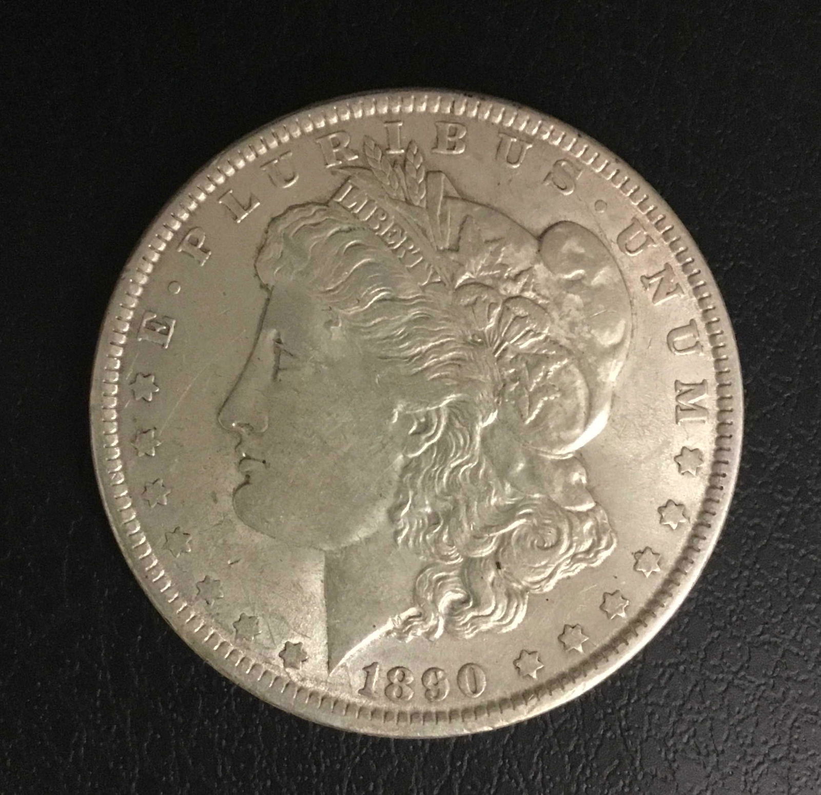 1890 Morgan Silver Dollar: Title: 1890 Morgan Silver Dollar Description: 1890 Morgan Silver Dollar Date/Period: 1890 Materials: 90% Silver Dimensions: 38.1mm Additional Info:AURAW Reserve: $25.00 Shipping: Domestic: Flat-rate o