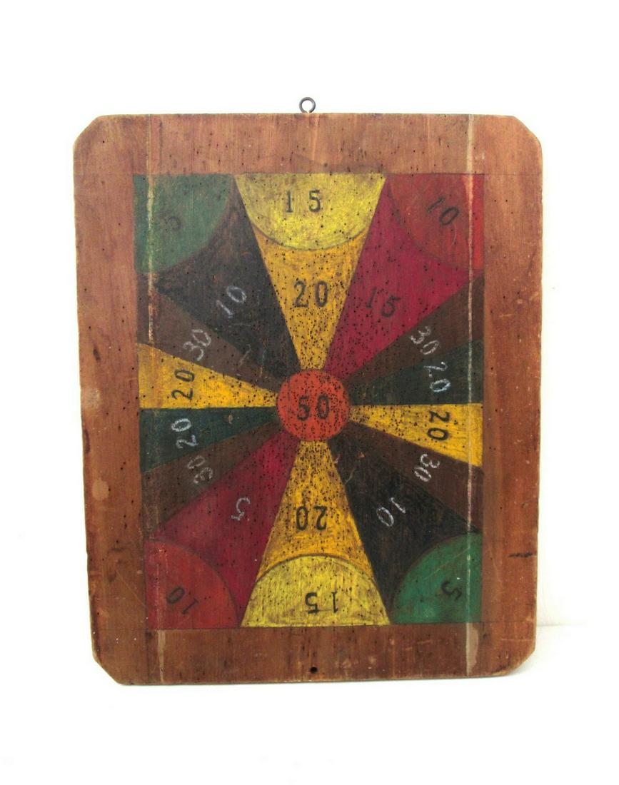 Early Colorful Darts Gameboard: Title: Early Colorful Darts Gameboard Date/Period: Mid-late 19th C Material: Pine Dimension: 21 3/4”H X 17 1/2”W X 7/8”D Provenance:Seven colors, against dark natural patina pine, dry surfaces, 