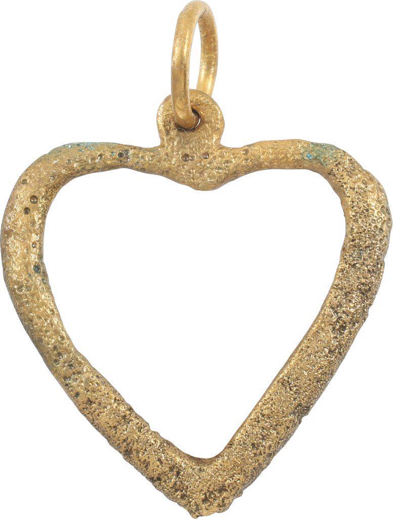 RARE VIKING HEART PENDANT, 9TH-10TH CENTURY AD: 1” height representing the heart in a fully developed form with a cusped top (a little shallower cusp than used today). Gilt bronze in pierced form. The surface textured form burial. The heart stood