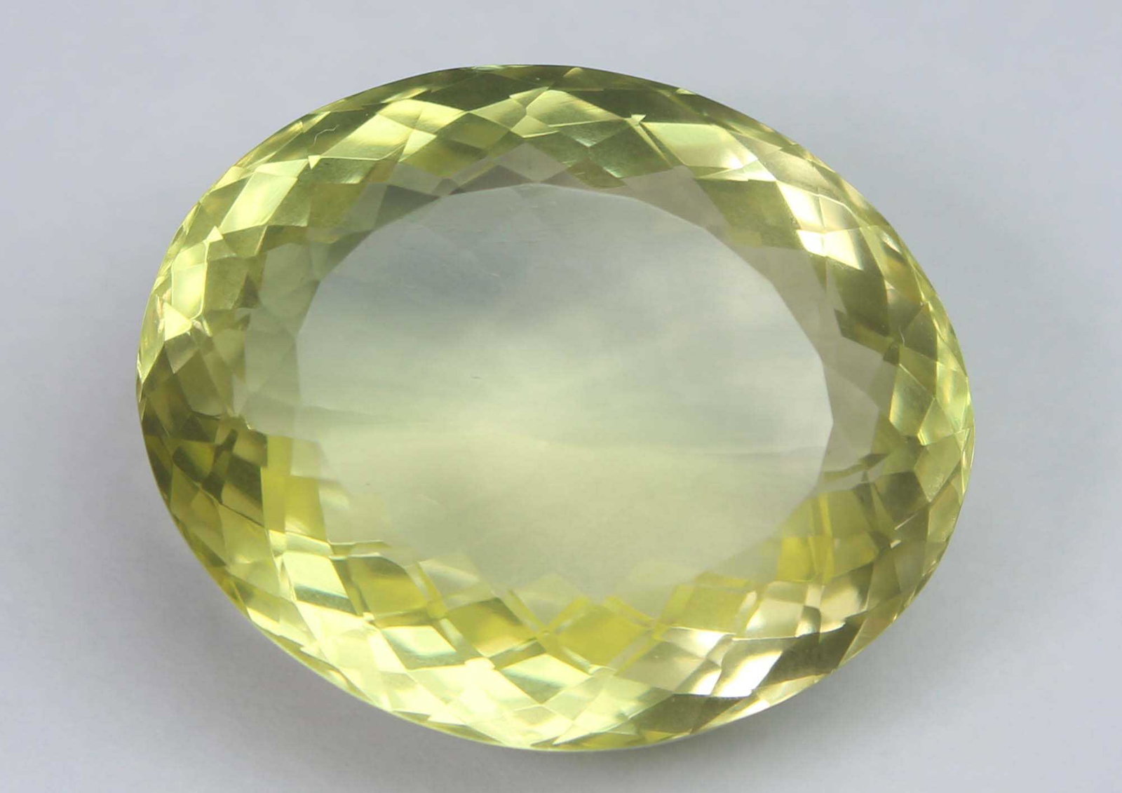 29.97 Ct Natural Lemon Quartz: No Reserve! Gemstone : Natural Lemon Quartz Weight : 29.97 Cts Shape : Oval Cut Colour : Greenish Yellow Dimensions : 22x18.5x11.1 mm Origin : Africa Transparency: transparent Shipping: Worldwide: Fl