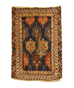 Antique Caucasian Kazak Small Rug 2'10 x 4'2: This antique Caucasian Kazak rug was woven in the late 19th Century and features a unique field design with alternating colored shield-like bird medallions floating on a saturated indigo blue