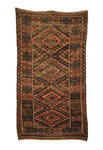 Antique Baluch Rug 3'1 x 5'3: This antique Baluch rug was woven in the late 19th Century by the Chakhansur artisans. It features four central hexagonal medallions that are surrounded by three alternating mirroring patterns with