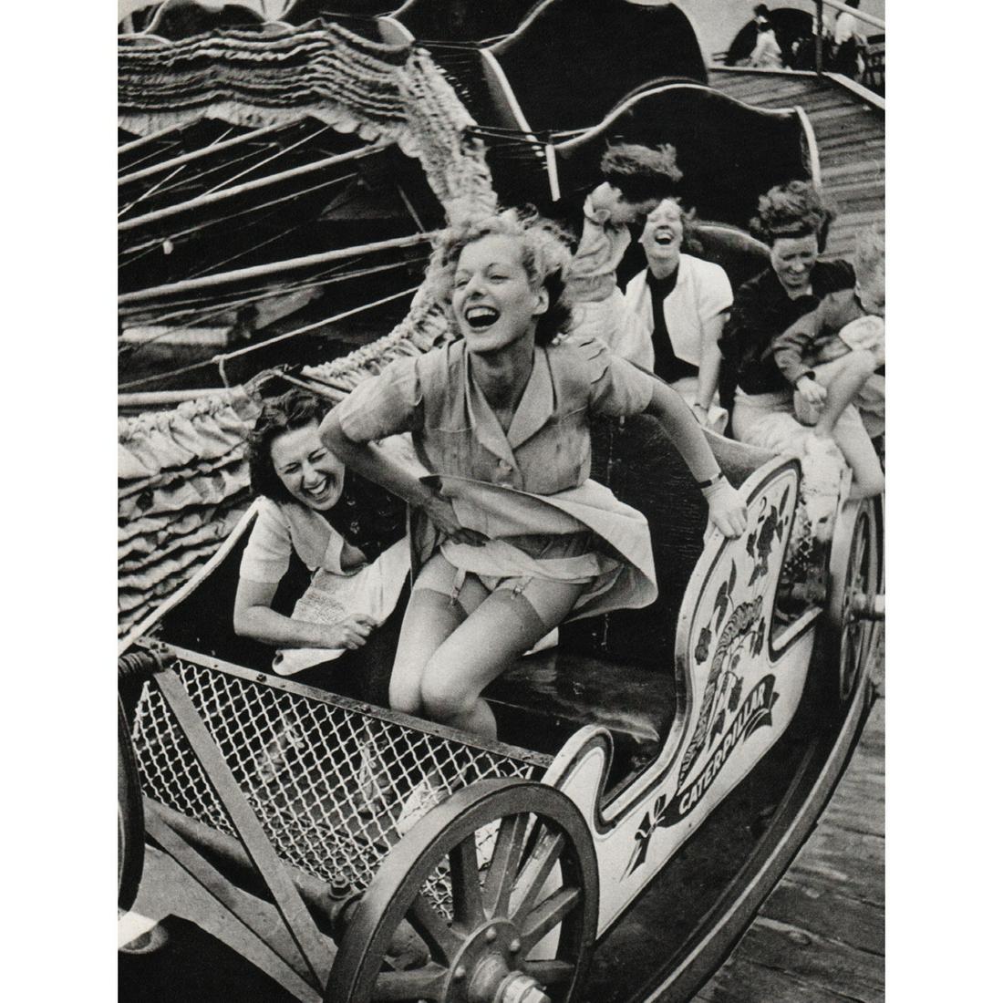 KURT HUTTON - Two at the Fair, Southend: Artist: KURT HUTTON Print Title: Two at the Fair, Southend, 1938 Medium: Sheet-fed Gravure Printing Date: 1970's Printed in Great Britain Image Size: 9 x 7 inches Kurt Hutton (1893-1960) was a German-