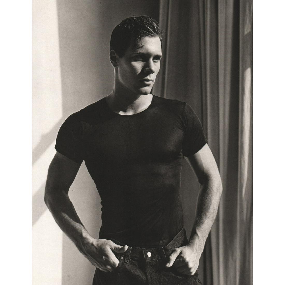 BRUCE WEBER - Ray Lata, 1986: Artist: BRUCE WEBER Print Title: Ray Lata, High School Football Player, NYC, 1986 Medium: Sheet-fed Gravure Printing Date: 1980's Printed in Spain Image Size approx: 11 X 8.5 inches Bruce Weber is an