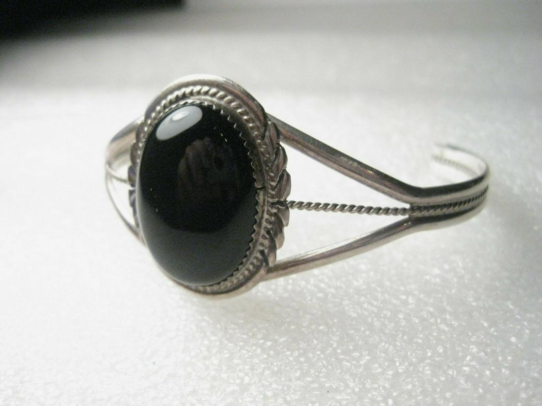 Southwestern Sterling Onyx Cuff Bracelet - L. Spencer,: Vintage 1970's style Southwestern Sterling & Onyx Cuff Bracelet - beautiful design featuring a large oval cut onyx/jet stone in a sawtooth bezel setting - it has a cutout and twisted rope accent. It i