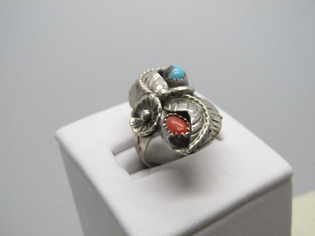 Vintage Sterling Southwestern Turquoise Coral Ring,: Vintage Southwestern Sterling Turquoise Coral Ring, feather, flower, scroll and bead work. Size 8, 5.41 grams. It is 1-1/8" long down the finger and 3/4" across the finger. The band is a split band at