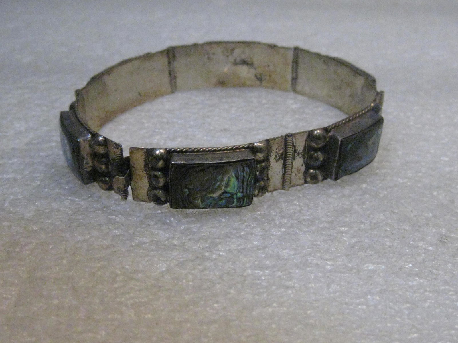 Vintage Sterling Silver Abalone Bracelet, Mexico,: Vintage Sterling Silver Abalone Bracelet, Mexico, signed LLA, 14.75 grams, 7" long and 1/2" wide. It's a beauty with curved links with a rectangular abalone bezel-set stone in each link with silver ba