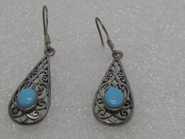 Vintage Sterling Turquoise Drop Earrings, Signed MC,: Vintage Sterling Scrolled Turquoise Earrings, Dangle Pierced with a Boho and southwestern theme. The scrolled pieces is 1.25" long and 5/8" wide with a 7mm by 5mm turquoise stone Signed MC 925. Age is