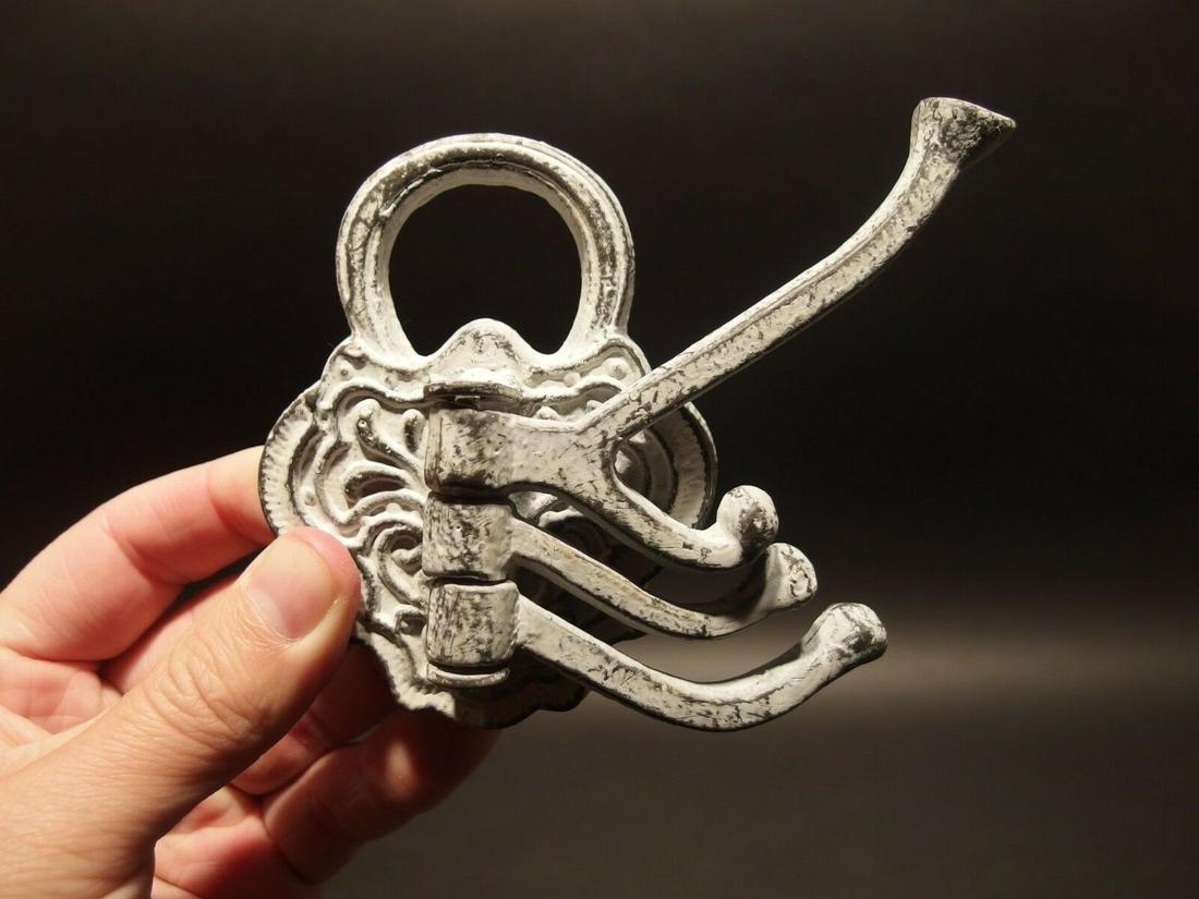 White Paint Cast Iron Lock Shape Swivel Hook: 1 hook 3 3/4" Overall height, 4 1/2" Extension, 3" Wide Charming old style metal hook. Great distressed old white paint look! Inspired by antiques these hooks are sure to impress! Reserve: $10.00 Ship