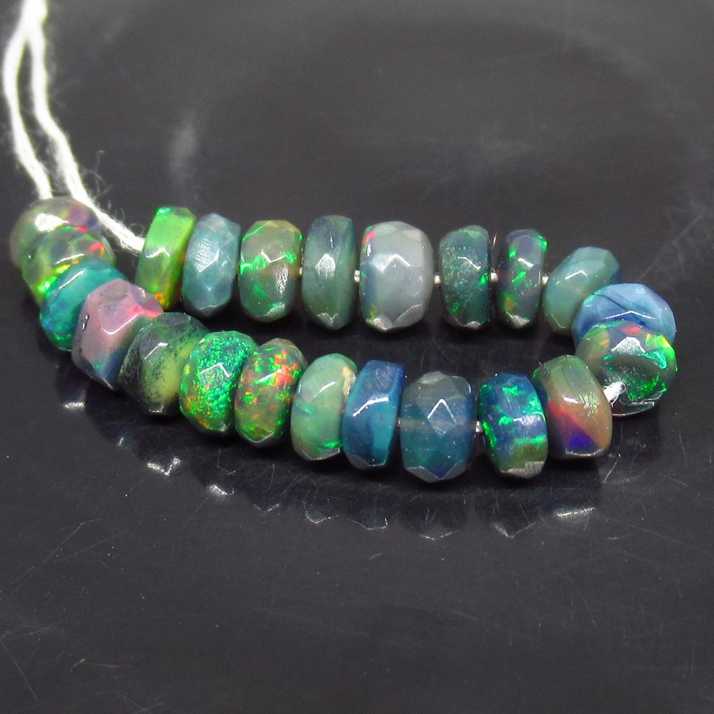 7.02 Ct Genuine 20 Drilled Faceted Fire Black Opal: No Reserve! Title: 7.02 Ct Genuine 20 Drilled Faceted Fire Black Opal Beads Stone Clarity: Translucent Gemstone: Natural Faceted Black Opal Beads Carat Weights: 4.90 Size/Dimensions: 3.90 to 4.50 mm /