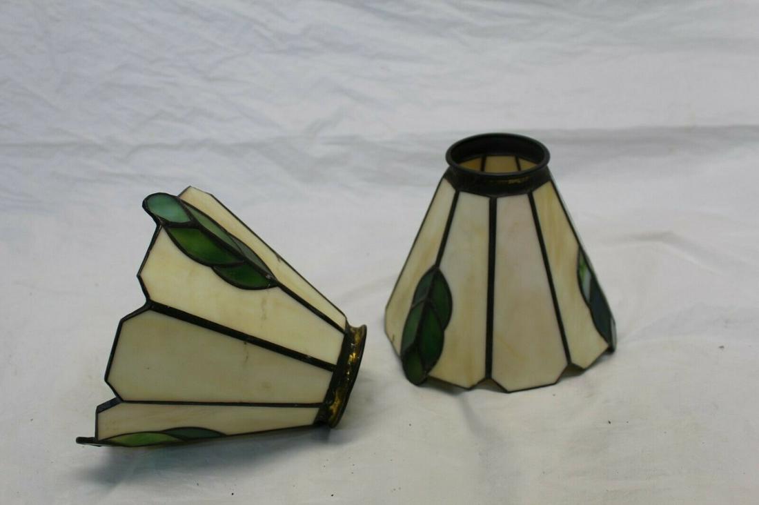 ART GLASS COPPER FOIL SHADES: ART GLASS COPPER FOIL SHADES. HONEY IN COLOR WITH LEAF DESIGN. 2 PIECES IN LOT. 4 IN TALL AND 5 1/2 IN DIAMETER AT THE OPENING. 2 1/4 IN FITTER. REGULARLY SELLING AT $60.00. SELLING HERE FOR $30 SHIPP