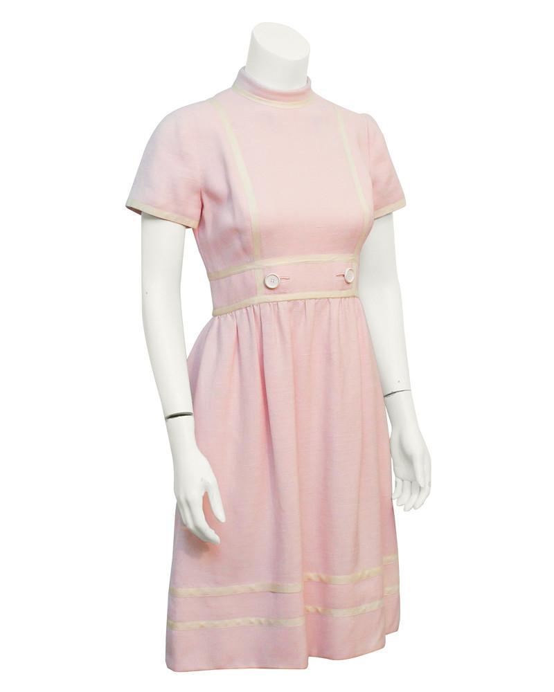 Geoffery Beene Pink Linen dress: Geoffrey Beene linen day dress from the 1960s. This sweet dress has white piping along all edges and is finished with 2 buttons at the waist. Zipper up the back. In excellent condition, perfect summer