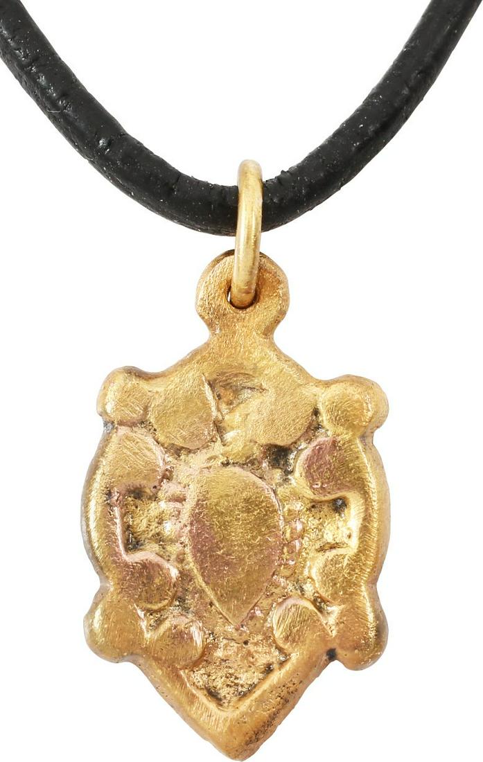 VIKING HEART PENDANT NECKLACE C.1000 AD JEWELRY: A good example in its fully evolved form. Flat embellished in deep relief with a centered naturalistic heart with beaded surround flanked by reverse curves forming the quartered nubs. Just under 7/8��