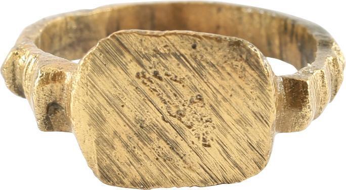 MEDIEVAL EUROPEAN RING SIZE 3: 11th-13th century. Size 3 with rounded face band flaring to tooth form shoulders. Raised rounded square bezel cut an overall angled pattern or texture, probably serving as a signet ring to seal wax an