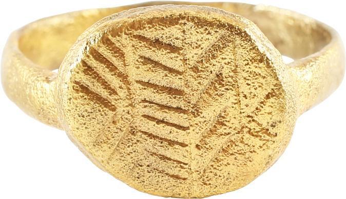 MEDIEVAL EUROPEAN RING.: 11th-13th century. Size 7 1/2 with rounded face tapered band. Raised oval bezel cut with four hatched bands, probably serving as a signet ring to seal wax and clay replacing an inked signature. Profes