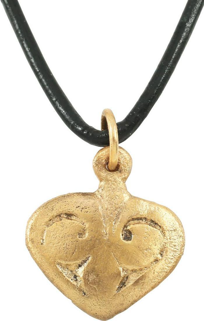 VIKING HEART PENDANT 900-1050 AD.: ¾Â” width of flat form, made bu the open face mold method. Broad border with a central pentafoil motif. The form of the heart is natural as in the body rather than stylized with the top cusp. Both