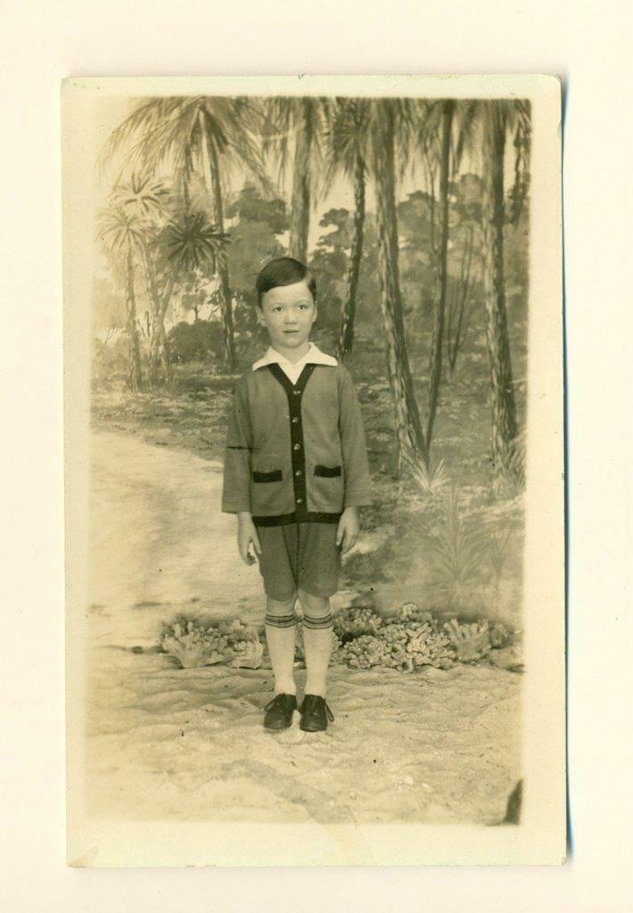 c1930 rppc BOY at PAINTED FAKE BEACH MOTIF BACK DROP, (1 of 2)