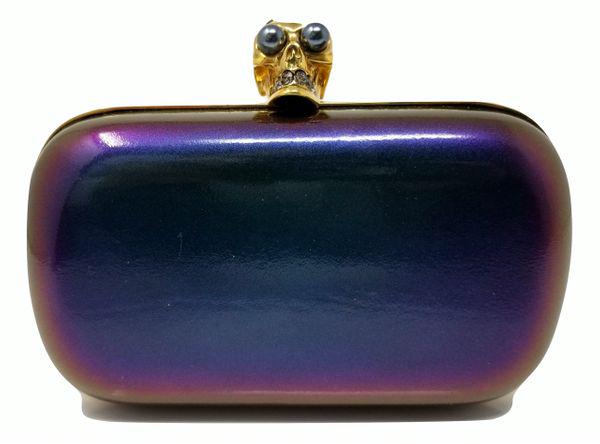 Alexander McQueen Skull Box Clutch Patent Leather: Iridescent multicolor leather Alexander McQueen Skull Box Clutch. This beautiful McQueen bag offers gold-tone hardware, black leather interior and push-lock closure featuring the iconic crystal skull
