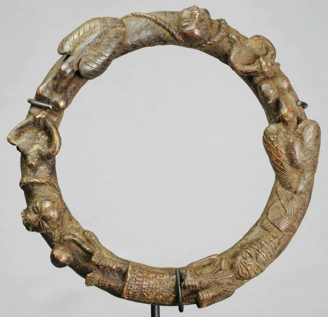 YORUBA Bronze altar Ring Human sacrifice Nigeria: Nigeria Rare bronze ring, YORUBA Scene of human sacrifice. These bronze rings were kept on altars These took place during coronations or royal funerals. The main character is a king, the other charact