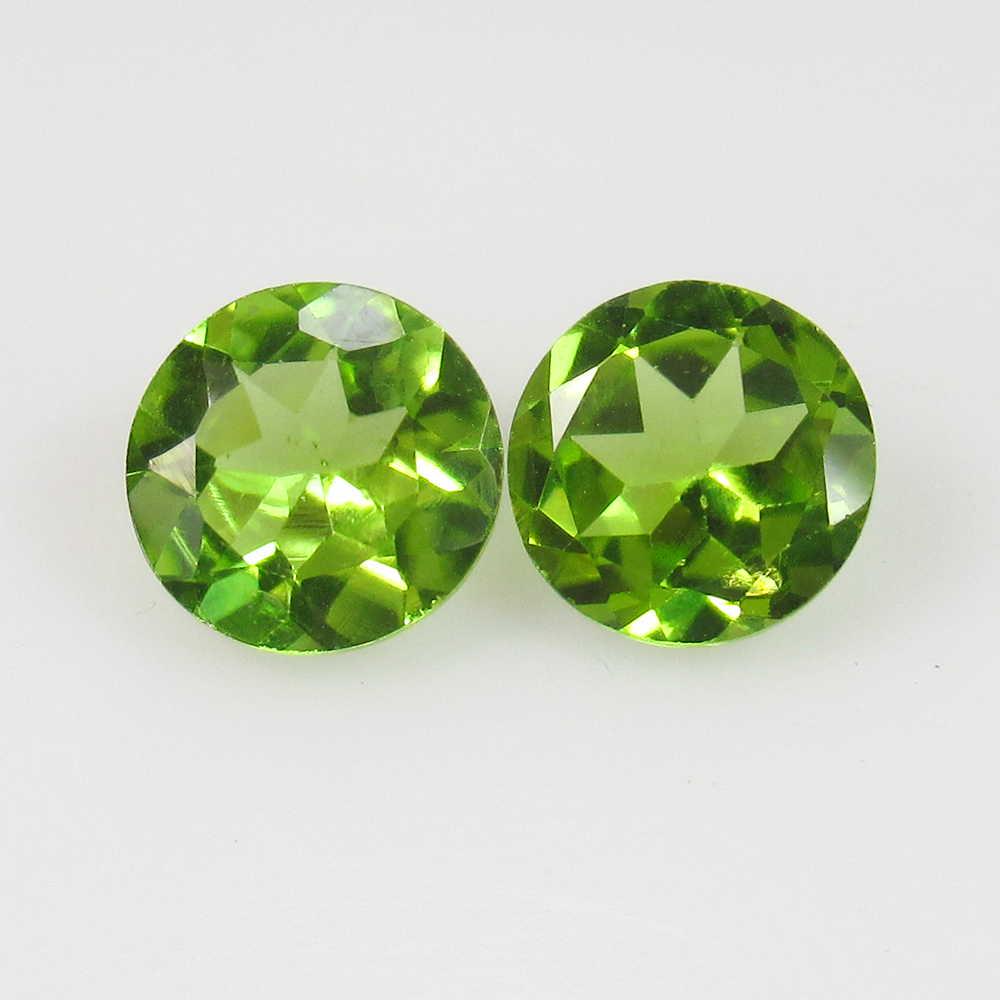 2.76 Ct Natural Pakistan Peridot Round Pair: No Reserve! Title: 2.76 Ct Natural Pakistan Peridot Round Pair Stone Clarity: VVS Gemstones: Natural Peridot Carat Weights: 2.76 Size/Dimensions: 7.00 x 7.00 x 4.00 mm / 2 PC's Additional Information: