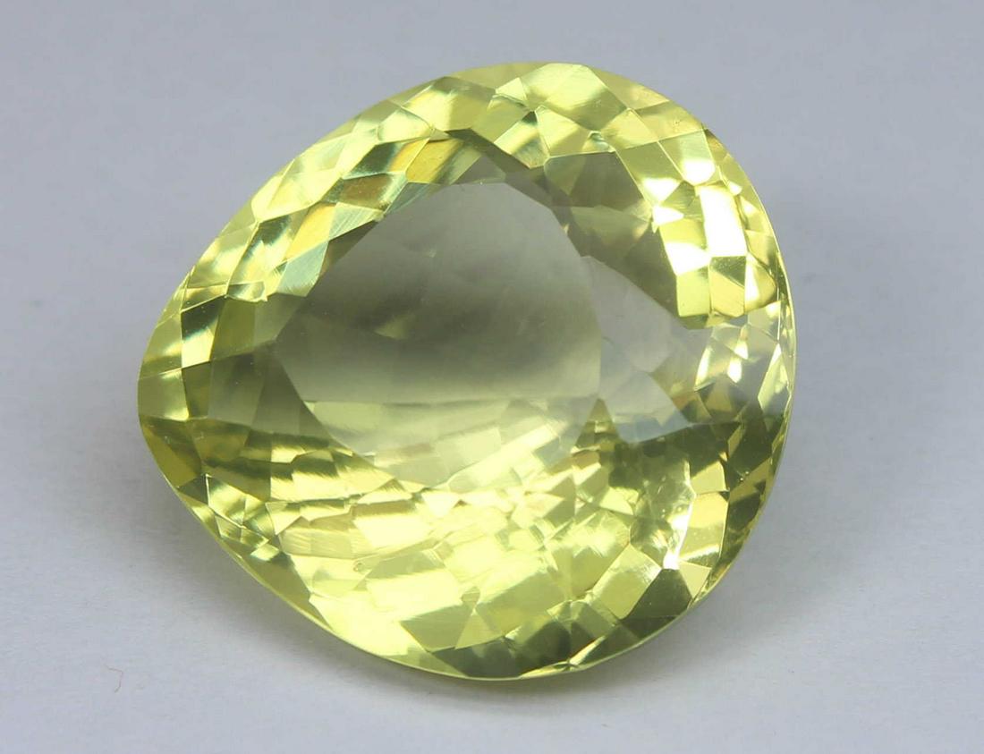 17.18 Cts Natural Lemon Quartz: No Reserve! Gemstone : Natural Lemon Quartz Weight : 17.18 Carats Dimensions : 18.3x17.5x10.4 mm Shape : Pear Cut Colour : Greenish Yellow Origin : Africa Treatment : Heated CLarity : VS Shipping: