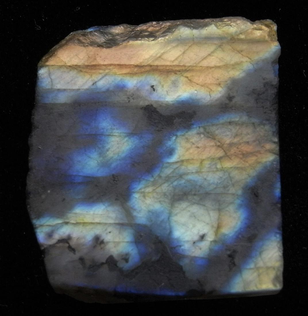 112.75 CT IRIDESCENT LABRADORITE: Title: 112.75 CT IRIDESCENT LABRADORITE Origin: Ampanihy, Atsimo-Andrefana, Madagascar Size: 3.5x3x0.8 cm / 22.55 gram Description: multicolored iridescent and translucent labradorite Reserve: $6.00 S