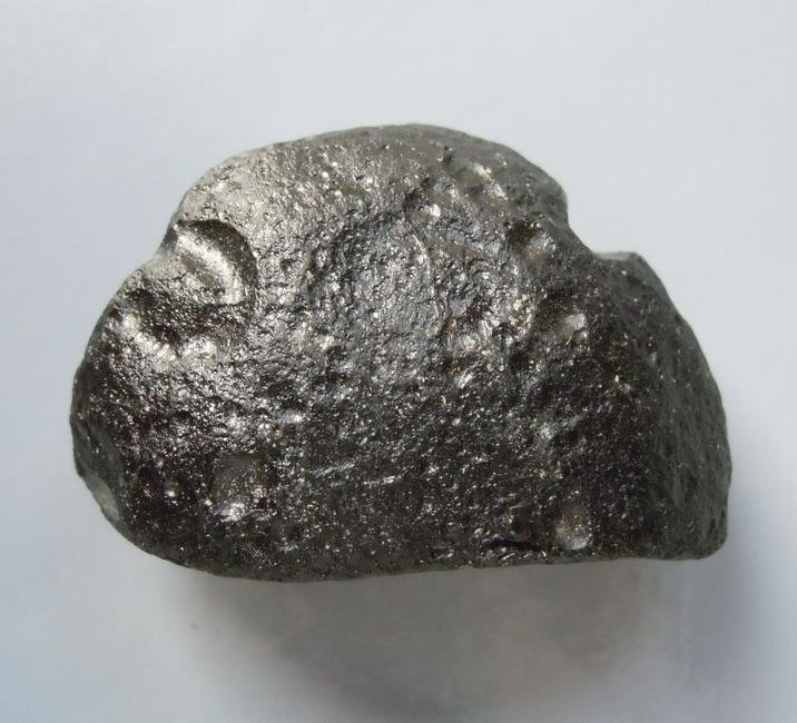 PHILIPPINITE TEKTITE - FROM METEORITE IMPACT: Title: PHILIPPINITE TEKTITE - FROM METEORITE IMPACT Origin: Paracale, Camarines Norte, Luzon, Philippines Size: 3x1.5x1 cm / 4 gram Description: elongate rizalite/philippinite tektite with lens shaped