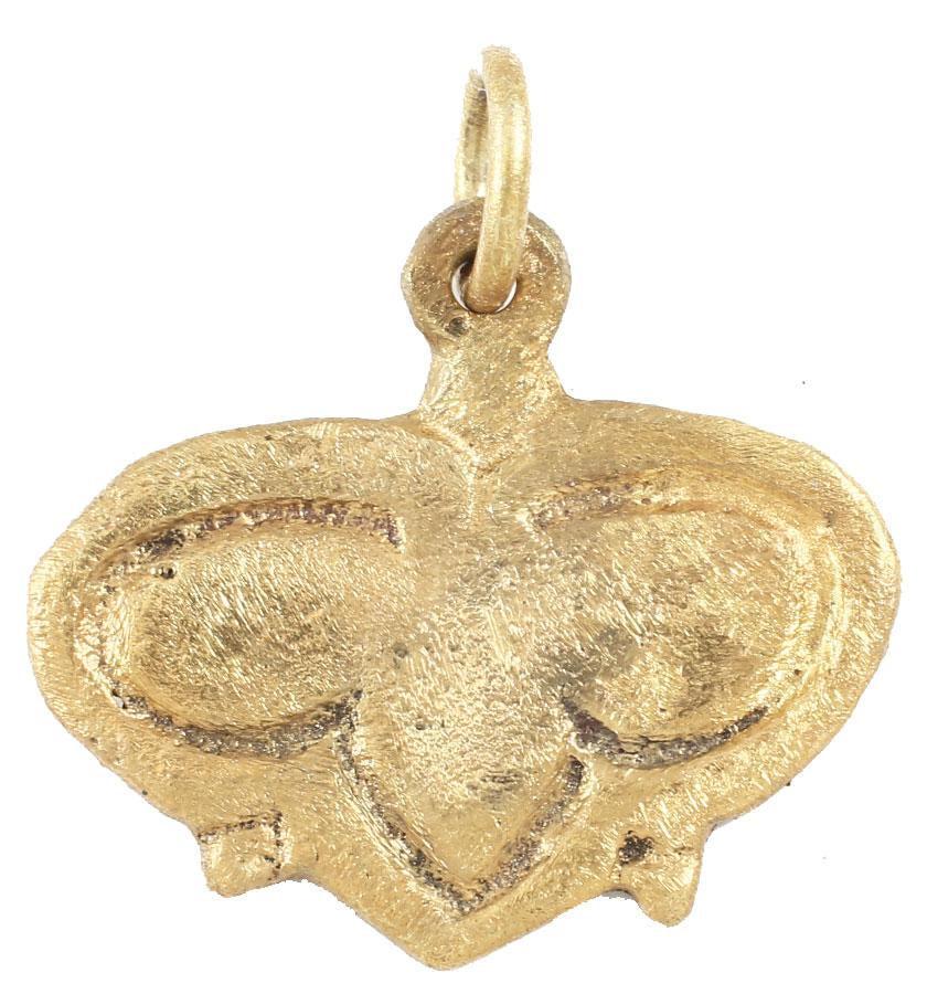 ICONIC VIKING HEART PENDANT 10TH-11TH CENTURY AD: Fully evolved form with cusped top and broad rounded edges defining a trefoil within. The foliate trefoil was a very popular motif for Viking hearts. Just over 3/4” width. The heart stood for braver