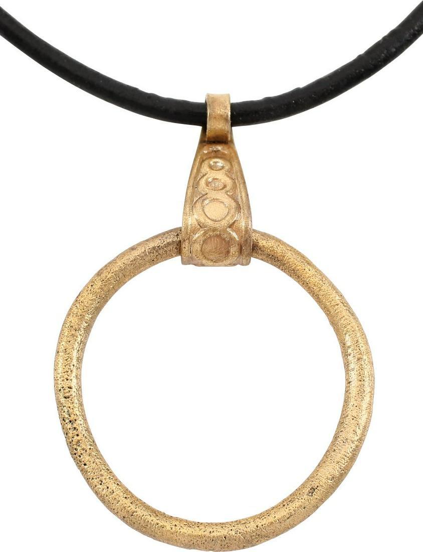 VIKING PROTECTIVE BROOCH 850-1000 AD: Gilt bronze, about 1 1/8” diameter. Rounded section. Worn in numbers on the surface of the jerkin, these small metal brooches provided a measure of protection against sword cuts and, in fact, were a