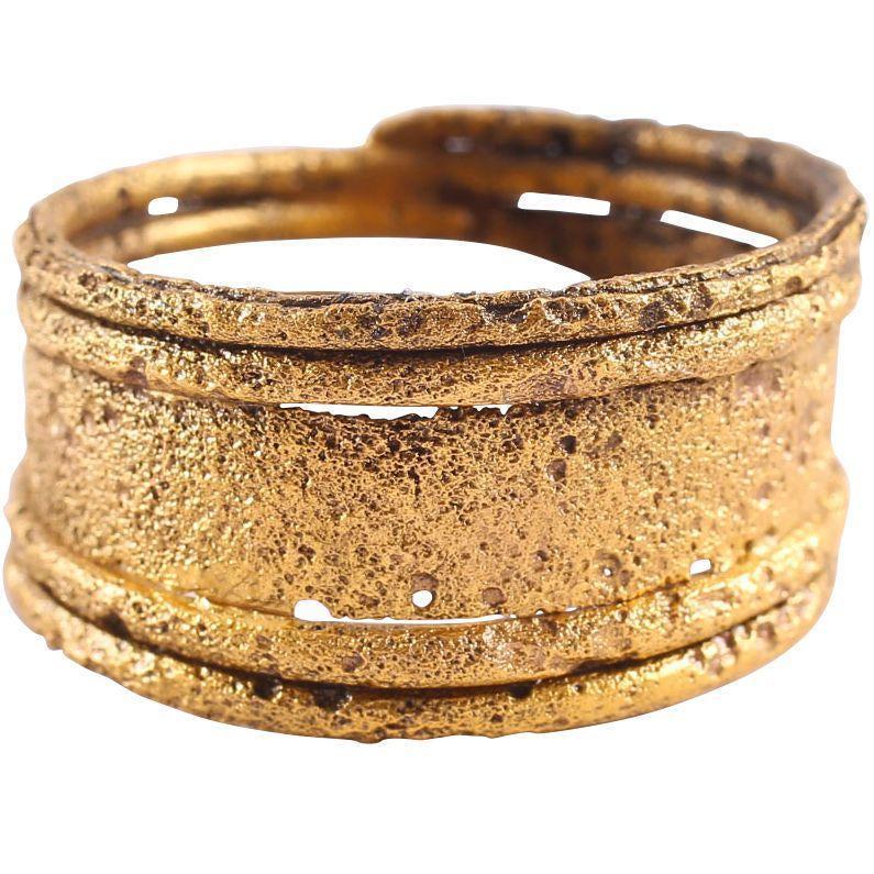 FINE VIKING WARRIOR’S RING 10th CENTURY: Size 10. Refinement of the coil form which was very popular with a medial flat tapering to circular section windings which flank it. Professionally refurbished with the gold overlay restored for conte