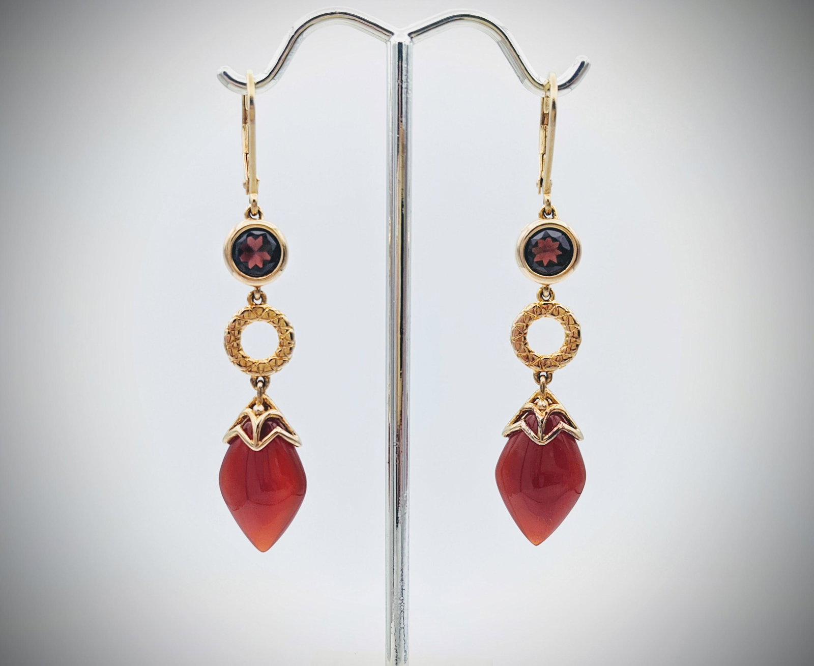 Pyrope Garnet & Carnelian Earrings: Title: Pyrope Garnet & Carnelian Earrings Brand: Jean Lin Collection Metal Purity: Gold Plated 925 Sterling Silver Gemstones: Pyrope Garnet & Carnelian Carat Weights: Each Earring has 1 Round Garnet a