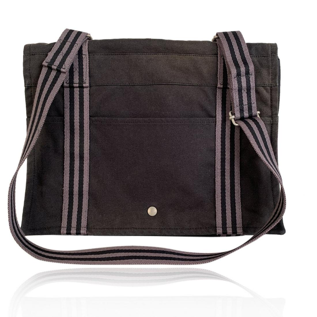 Hermes Black Gray Cotton Canvas Fourre Tout Besace: - Model: HERMES FOURRE TOUT BESACE Messenger Bag - Made in France - Black and gray colors - Material: 100% cotton - It has snaps on both sides for expansion - 1 open pocket on the front and 1 on the b