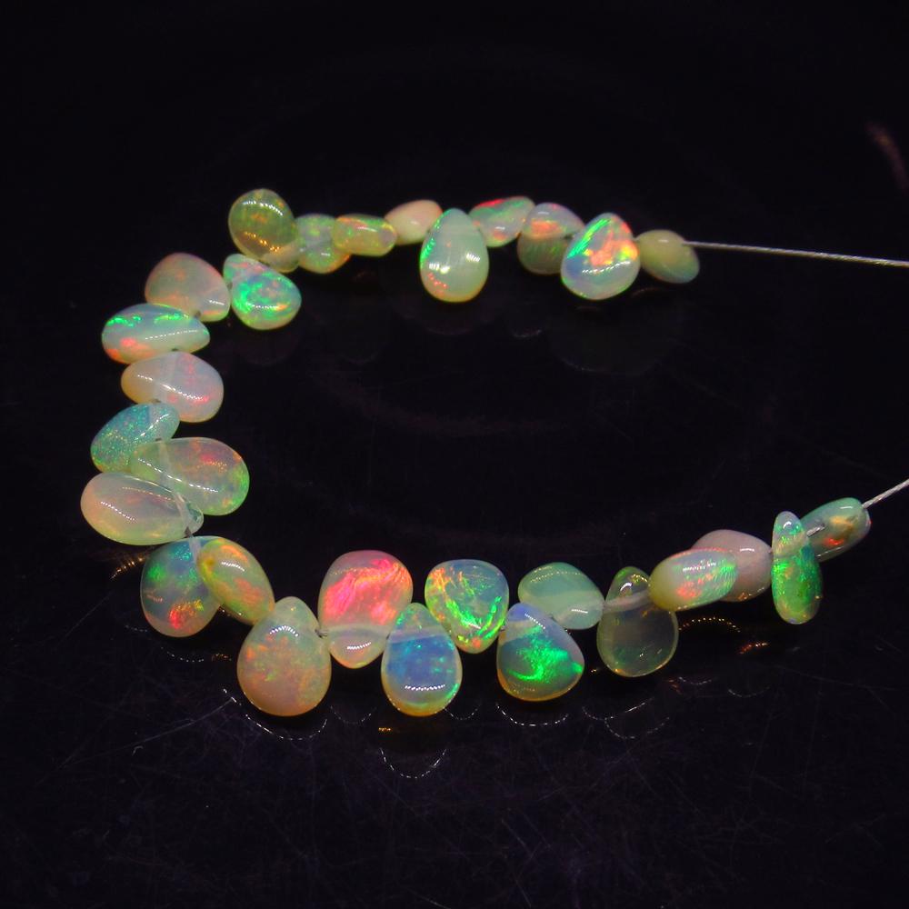 10.59 Ct Natural 29 Drilled Pear Multi-Color Fire Opal (1 of 2)
