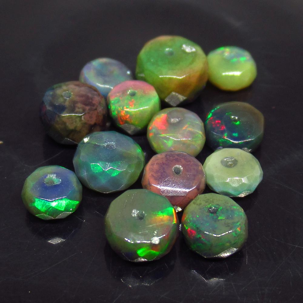 9.56 Ct Natural 13 Drilled Faceted Fire Black Opal: No Reserve! Title: 9.56 Ct Natural 13 Drilled Faceted Fire Black Opal Beads Stone Clarity: Translucent Gemstone: Natural Faceted Black Opal Beads Carat Weights: 9.56 Size/Dimensions: 5.30 to 7.70 mm /